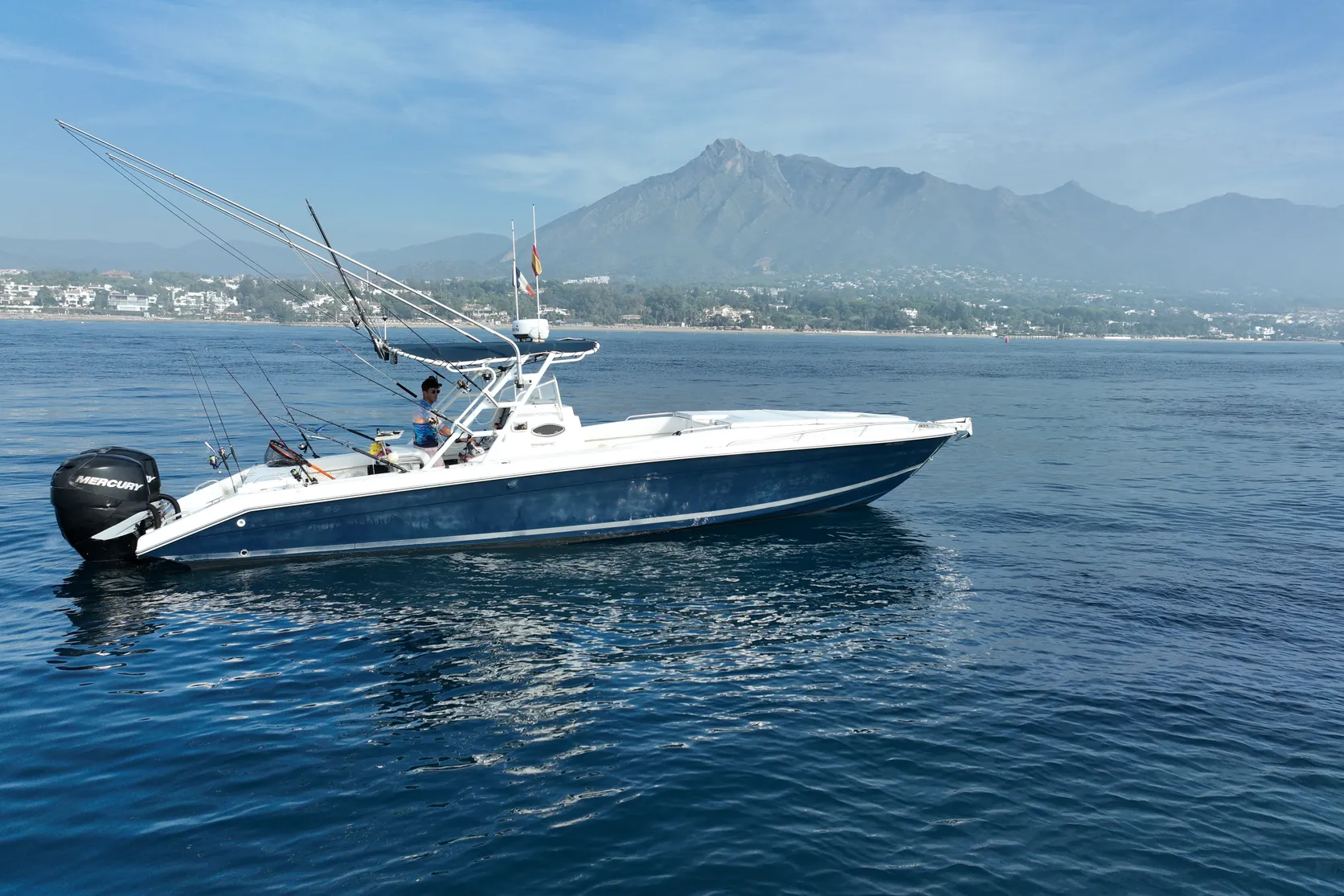 Aerial view of STRIKE 360 with rods in the holders and outriggers raised, La Concha mountain behind