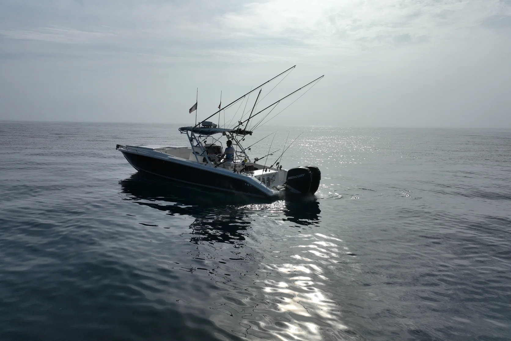 STRIKE 360 with rods rigged on a calm sea in soft, hazy light off Marbella