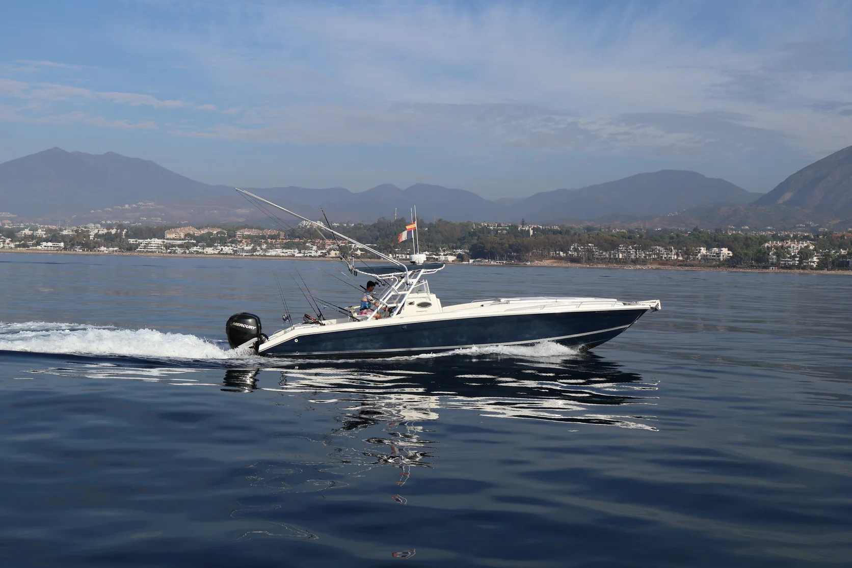 STRIKE 360 leaving a white wake as it runs along the Marbella coastline