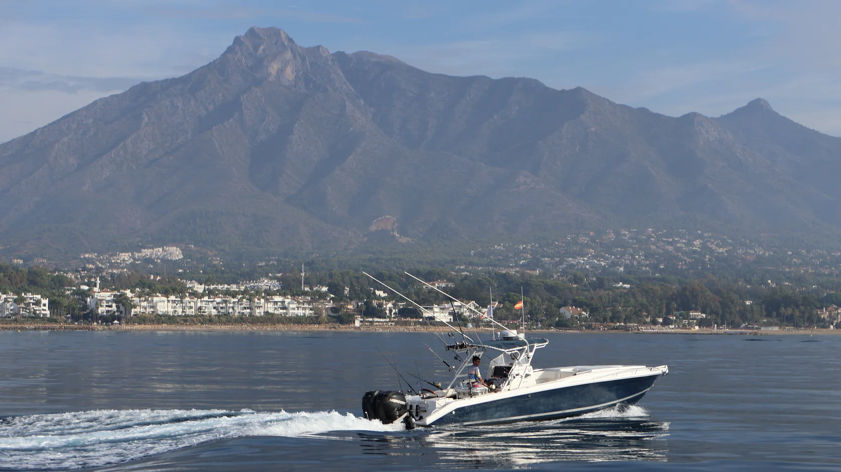 STRIKE 360 cruising past the Marbella shoreline beneath La Concha mountain
